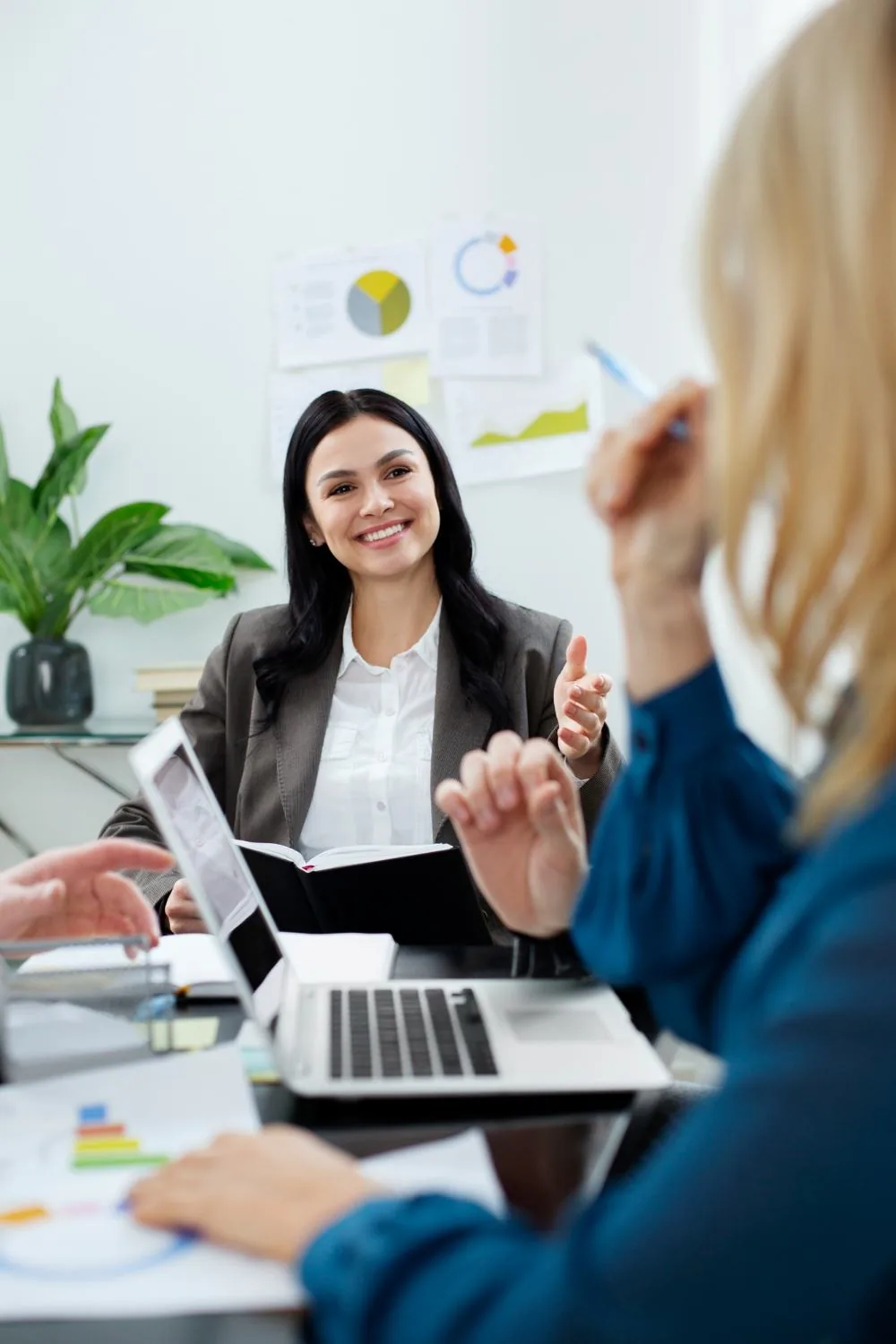 Ennova recruitment consultant smiling during a meeting with a client
